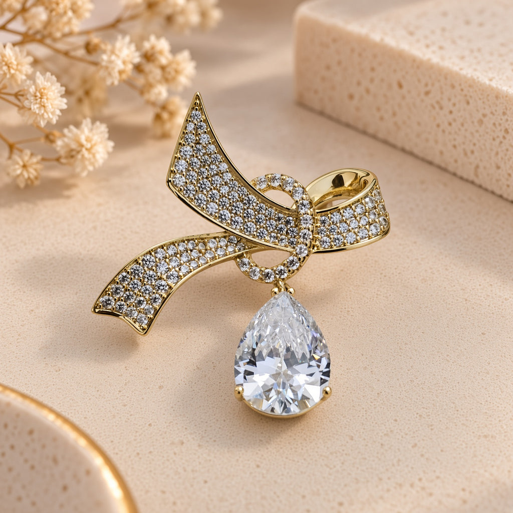 Teardrop Solitaire Pave Ribbon Knot Gold Brooch (MES100123)